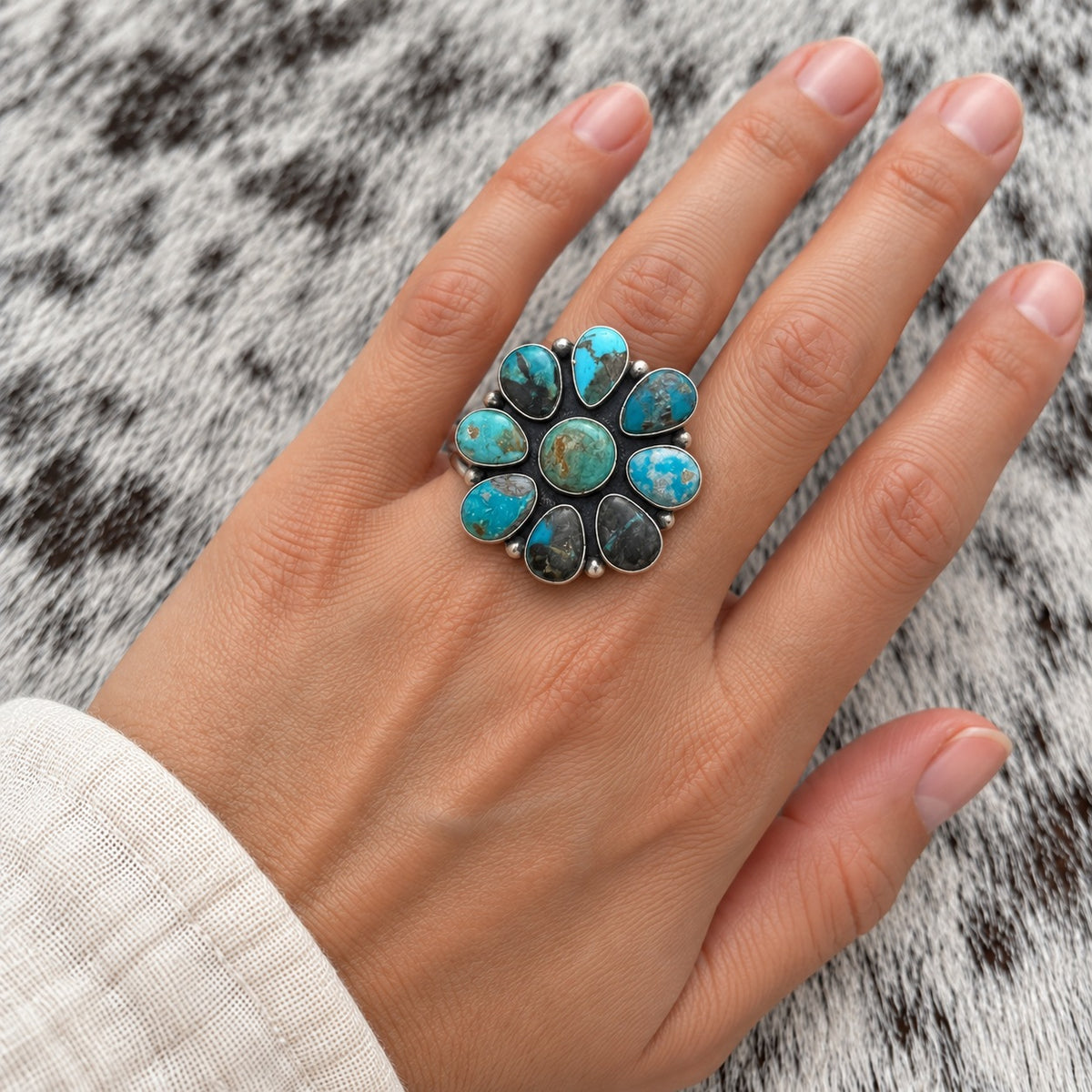 Blue Moon Turquoise Cluster Ring worn around a finger; approximate scale