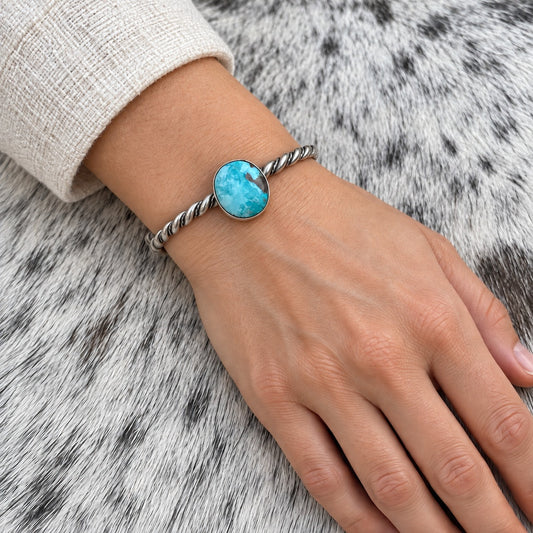 Elaine Tahe Navajo Artist Turquoise Bracelets in Sterling Silver worn on an adult model's wrist
