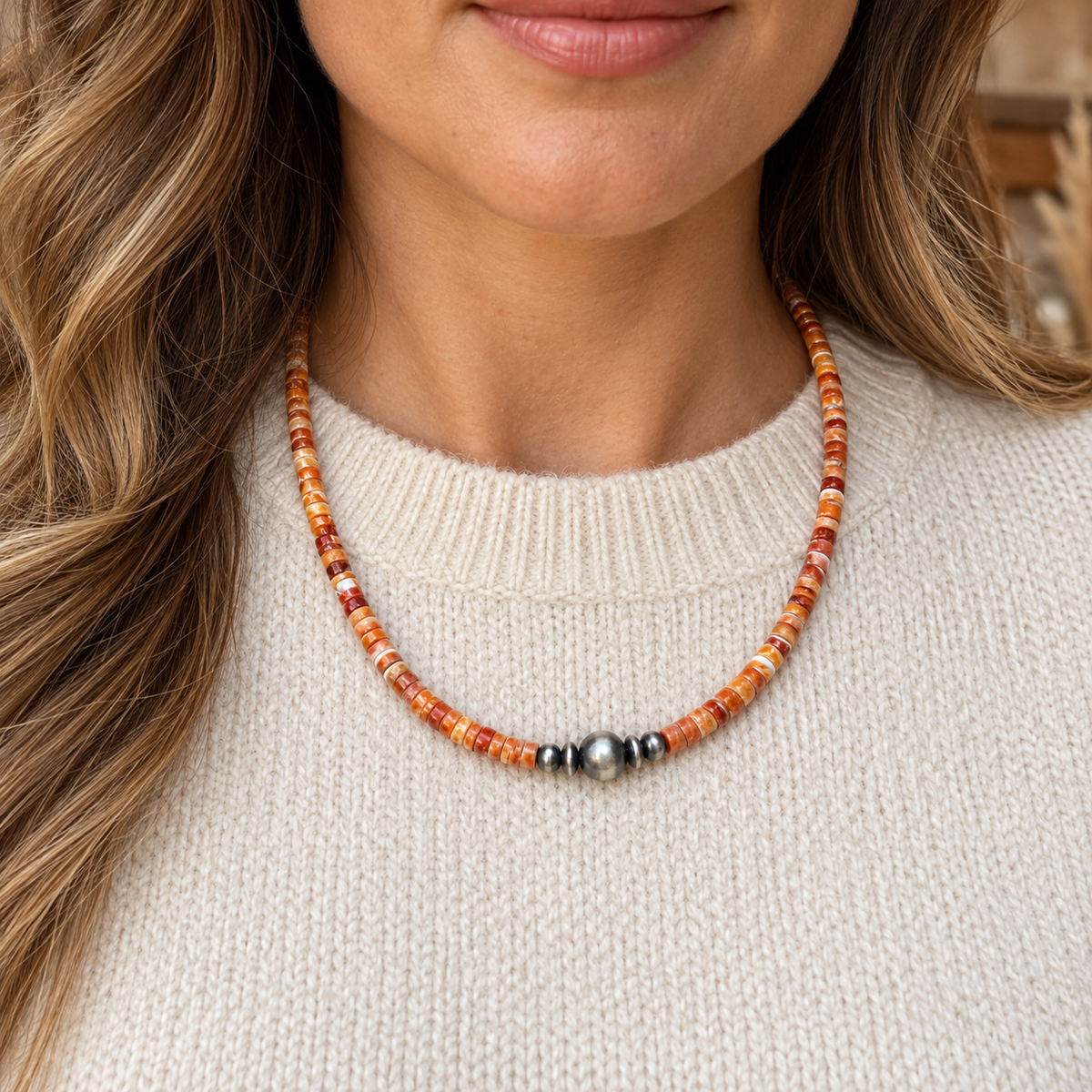 Graduated Silver Desert Pearls & Spiny Oyster Shell Heishi Necklace worn over a cream crew-neck top.