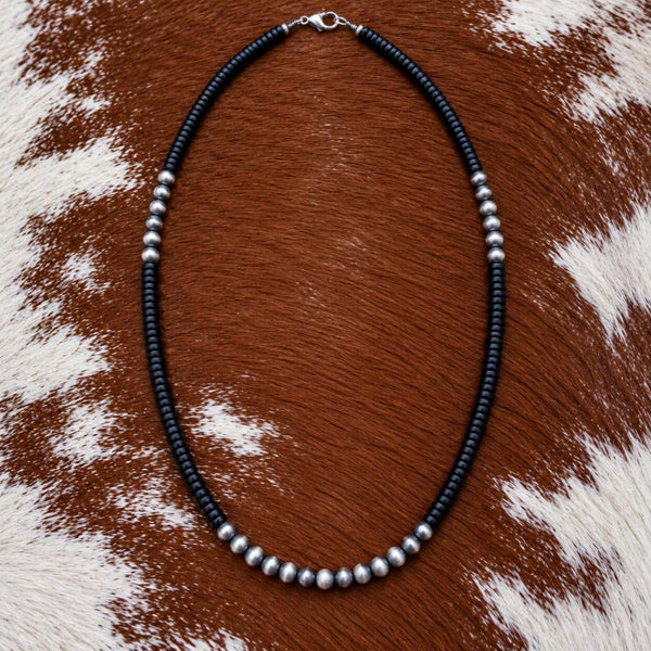Silver Desert Pearls and onyx heishi necklace on cowhide