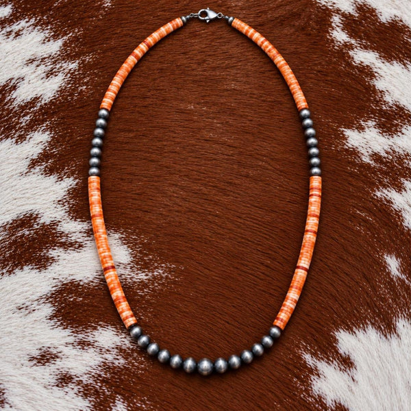 Silver Desert Pearls and orange spiny oyster shell heishi necklace on cowhide