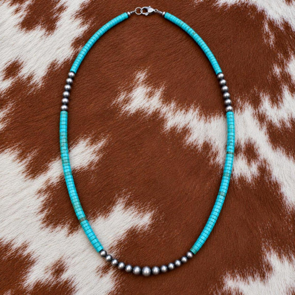 Silver Desert Pearls and turquoise heishi necklace on cowhide