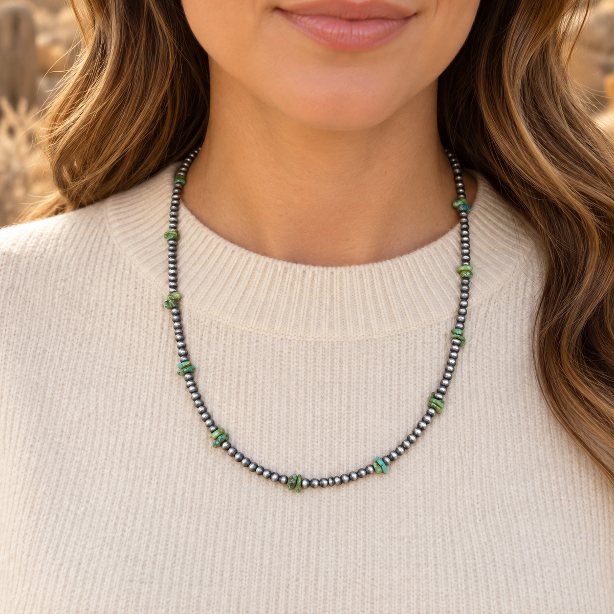 Silver Desert Pearls & Sonoran Gold Turquoise Chips Necklace worn over a cream crew-neck top.