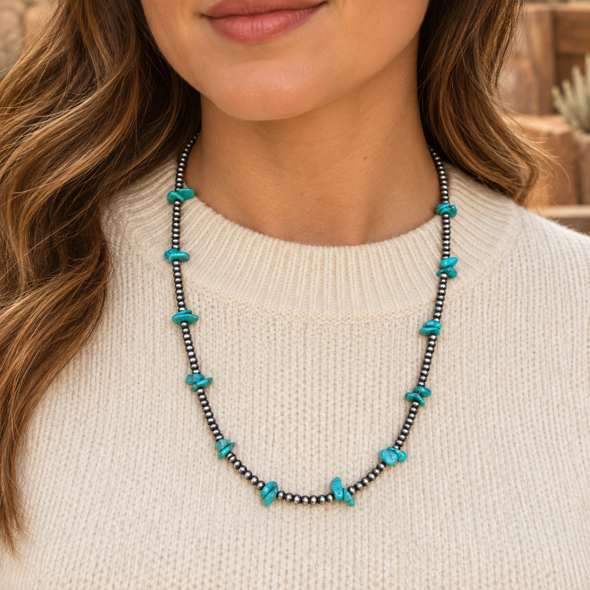 Silver Desert Pearls & Turquoise Chips Necklace worn over a cream crew-neck top.