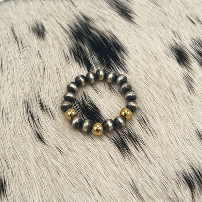 Another view of the gold filled and silver bead stretch ring on cowhide