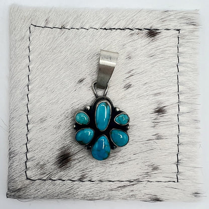 Front view of Sheila Becenti 6-stone Sonoran turquoise cluster pendant with wide silver bail
