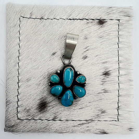 Front view of Sheila Becenti 6-stone Sonoran turquoise cluster pendant with wide silver bail