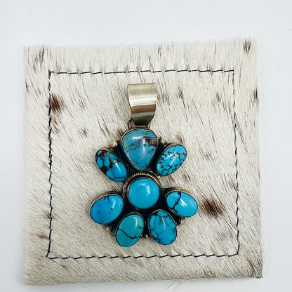 Front view of Bobby Johnson 8-stone turquoise cluster pendant