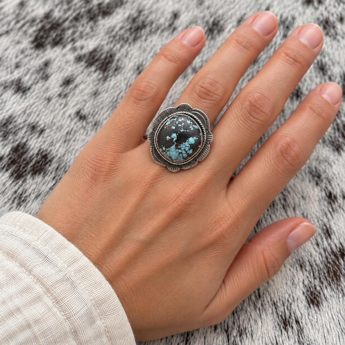 Blue Moon Turquoise Adjustable Ring worn around a finger; approximate scale