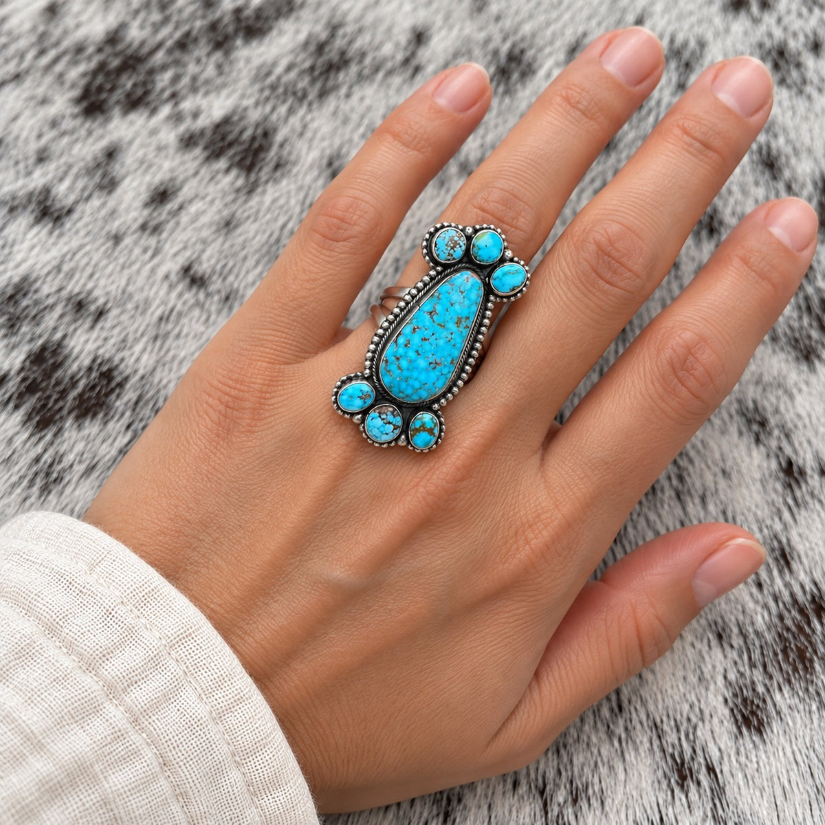 Kingman Turquoise Cluster Adjustable Rings — lifestyle worn around a finger; approximate scale
