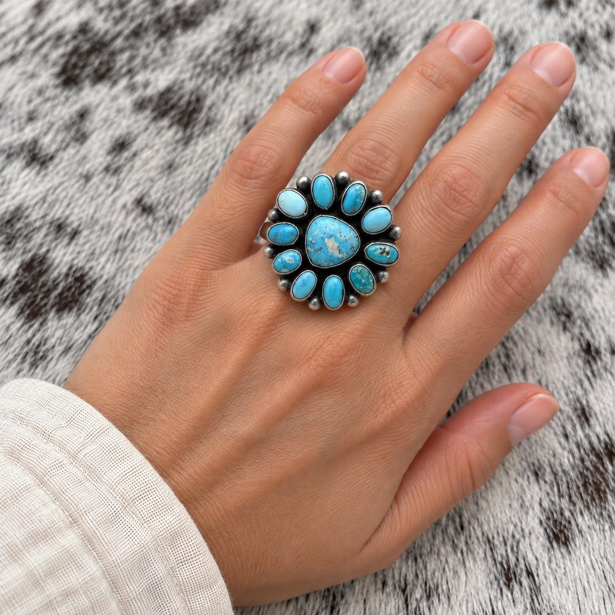 Sonoran Turquoise Cluster Ring — lifestyle worn around a finger; approximate scale