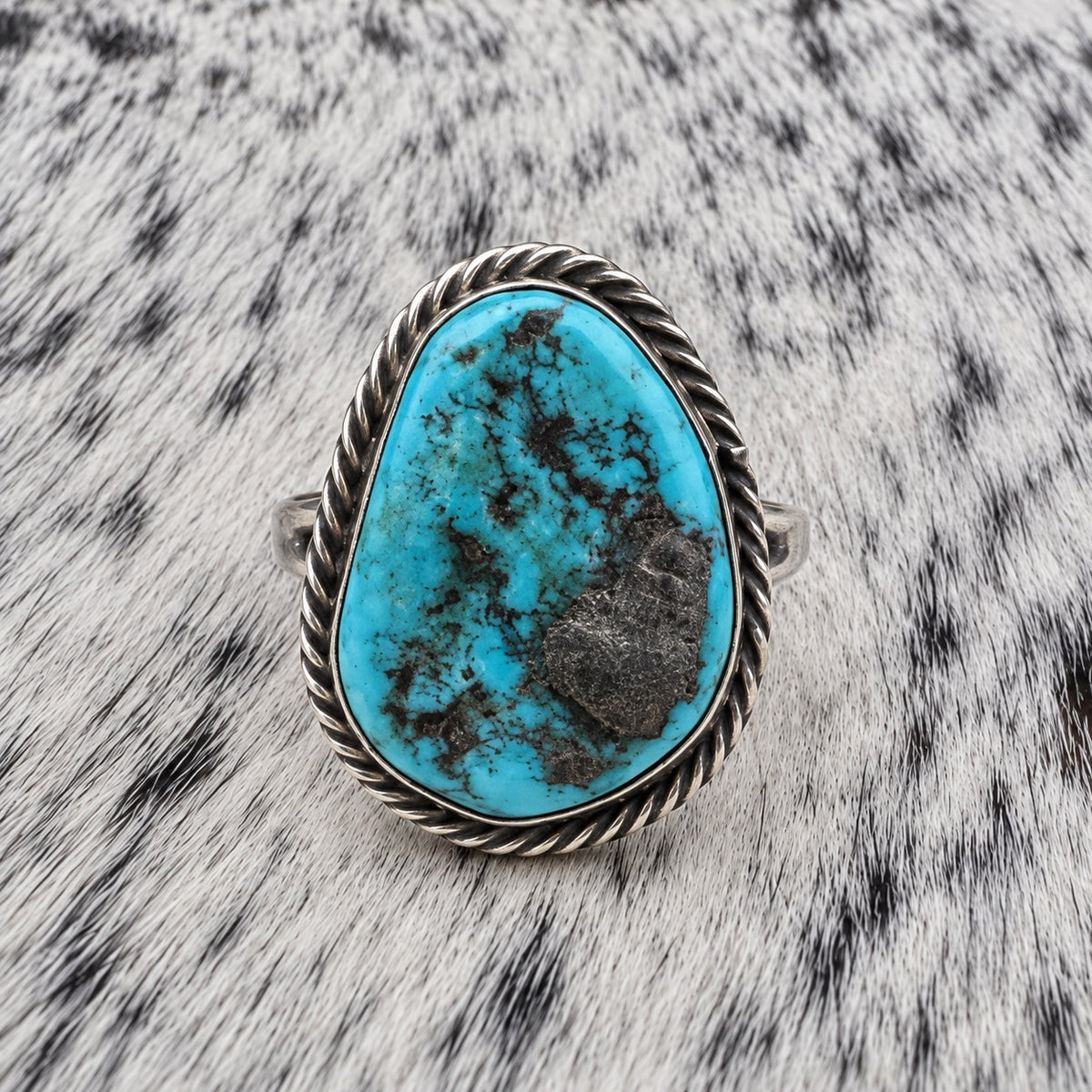 Unpolished Kingman Turquoise Ring by Susan Cooke — front view on gray-and-white cowhide